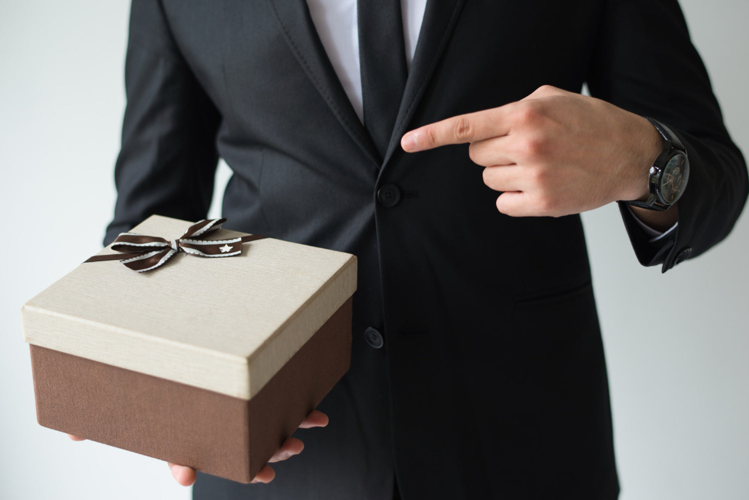 Unrecognizable Businessman Holding Brown Gift Box 1 ?v=1633341607&width=1500
