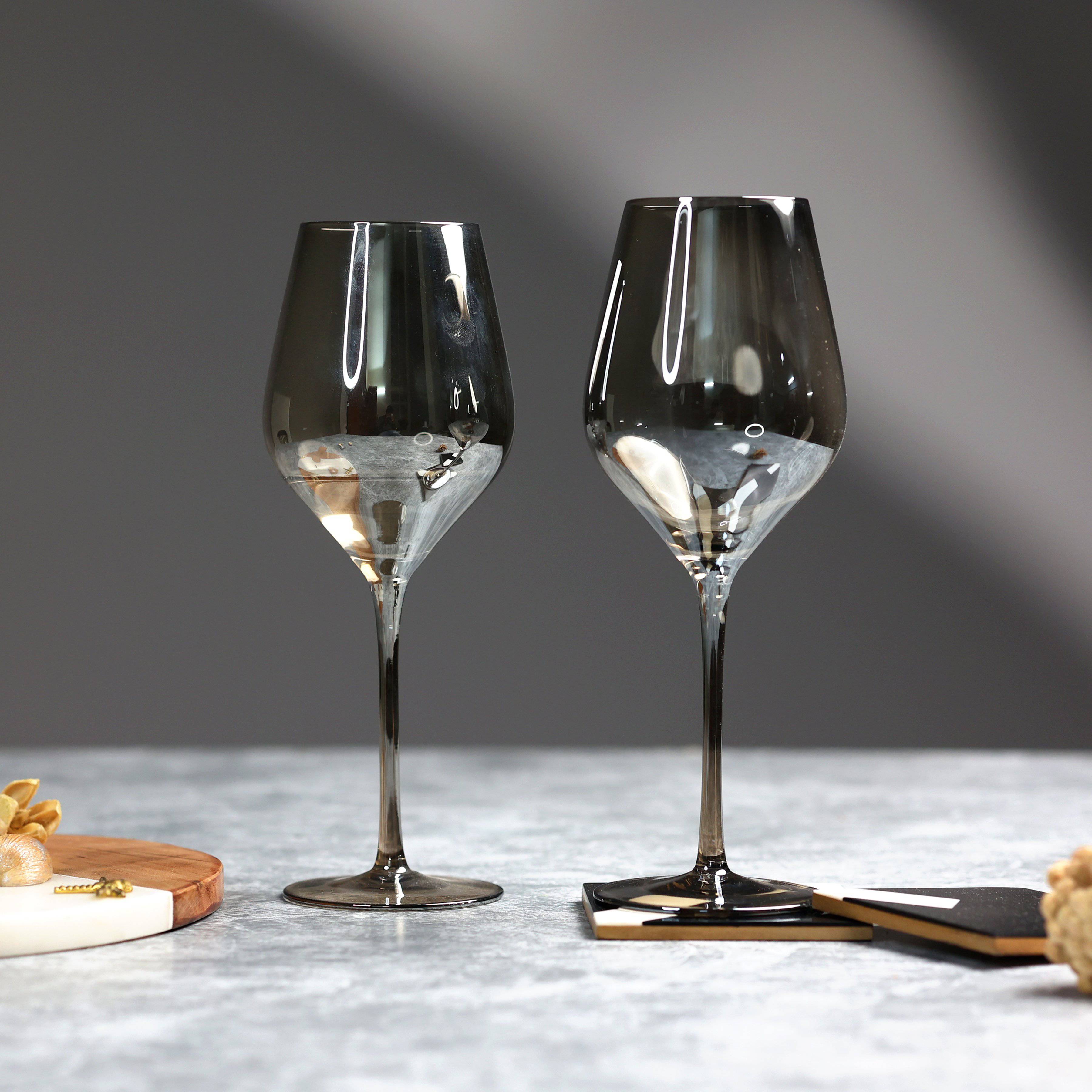 https://www.thedecorcircle.com/cdn/shop/products/the-decor-circle-dinnerware-barware-ash-smokey-grande-wine-glasses-set-of-2-set-of-6-28306443763901.jpg?v=1647619569